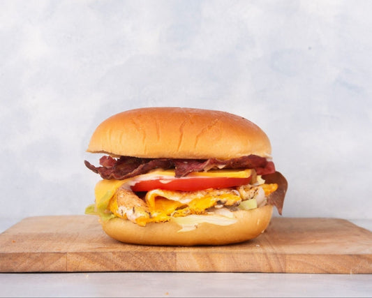 Delicious Fried Egg Burger with Beef Bacon from Heraan Al Dar Cafeteria, featuring a perfectly fried egg, crispy beef bacon, and fresh ingredients. This mouthwatering burger showcases the rich flavors and textures, making it a standout choice for burger lovers.