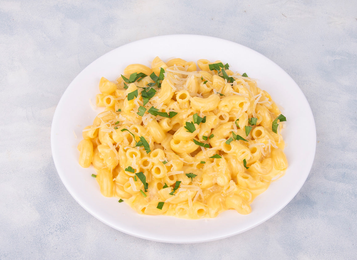 Delicious Creamy Macaroni And Cheese dish from Heeran Al Dar Cafeteria, showcasing perfectly cooked pasta in rich cheese sauce.