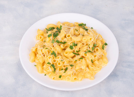 Delicious Creamy Macaroni And Cheese dish from Heeran Al Dar Cafeteria, showcasing perfectly cooked pasta in rich cheese sauce.