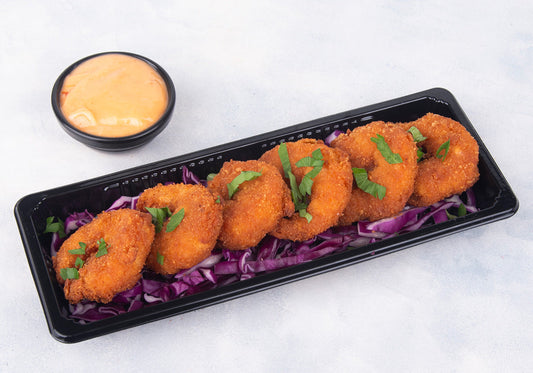 Dynamite Shrimp from Heraan Al Dar Cafeteria, a crispy fried shrimp appetizer coated in creamy spicy dynamite sauce, perfect as a spicy shrimp appetizer starter.
