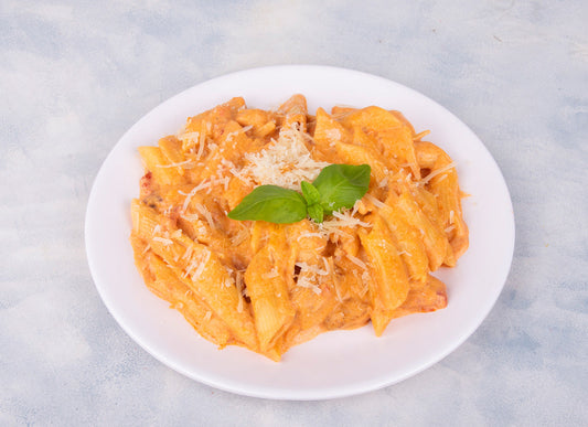 Pasta with Mixed Sauce from Heeran Al Dar Cafeteria, featuring pasta tossed in a blend of creamy white and tangy red sauce, showcasing delicious Pasta With Creamy White And Tangy Red Sauce.