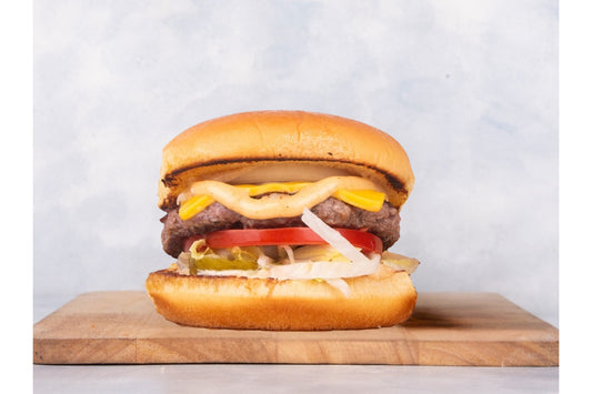Juicy Lamb Burger served by Heeran Al Dar Cafeteria, featuring a fresh, grilled patty marinated with special spices, nestled in a soft bun.