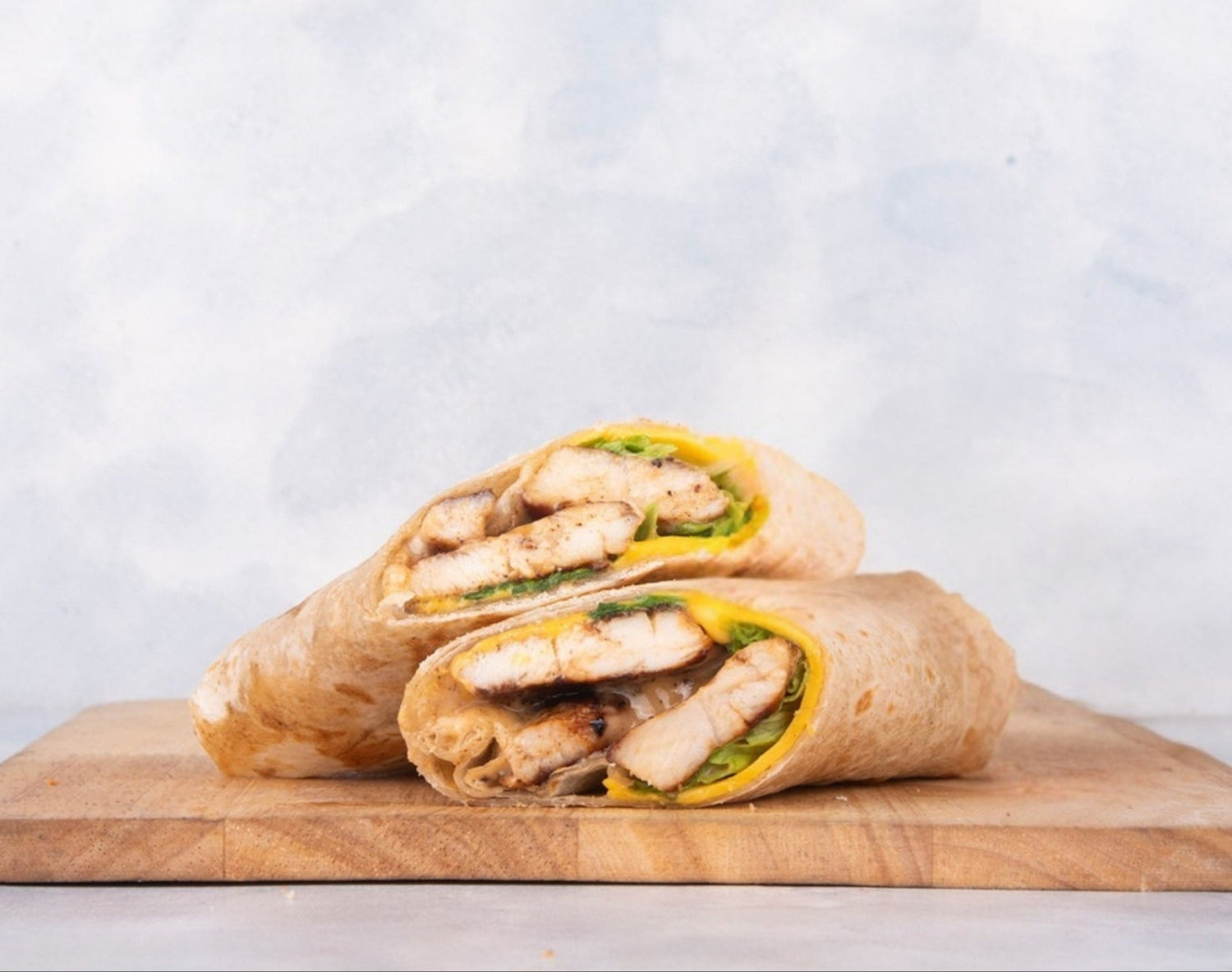 Delicious Grilled Chicken Wrap showcasing flavorful wraps | fresh & delicious sandwiches made with grilled chicken, fresh veggies, and bold sauces.