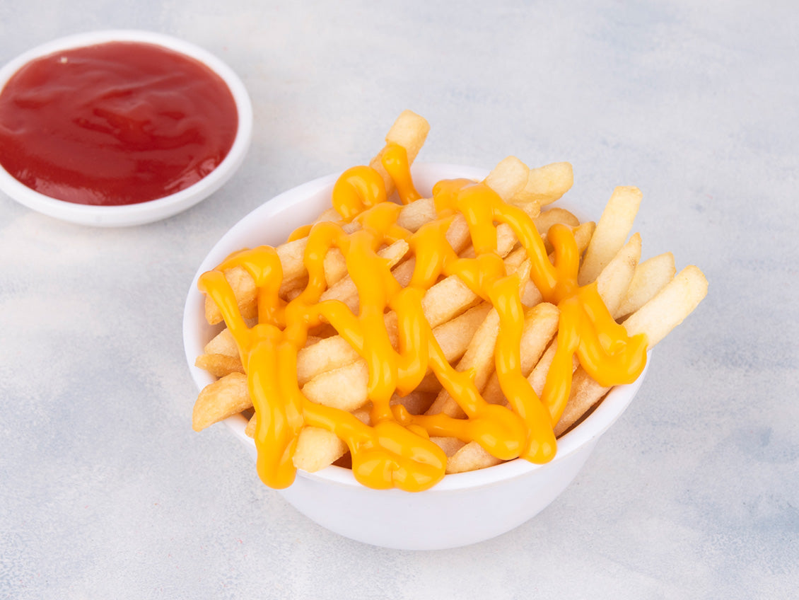 Crispy fries with cheese topped with rich melted cheese sauce from Heraan Al Dar Cafeteria